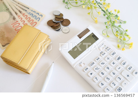 Household management and saving: calculator, cash and wallet 136569457