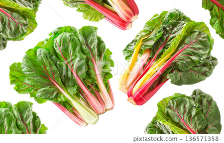 Fresh rainbow Swiss chard leaves with vivid red and yellow stems arranged in a seamless pattern isolated on white background Fresh rainbow Swiss chard leaves with vivid red and yellow stems arranged in a seamless pattern isolated on white background 136571358
