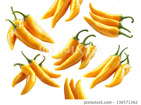 Fresh yellow chili peppers in various bunches, isolated on clean white background, concept of spicy food 136571362