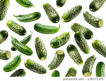 Multiple fresh green cucumbers arranged in a seamless pattern isolated on white background, healthy food and organic produce 136571375
