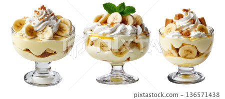 Banana pudding dessert with whipped cream and mint leaves in glass cup, isolated on white background, concept of sweet treat Banana pudding dessert with whipped cream and mint leaves in glass cup, isolated on white background, concept of sweet treat 136571438