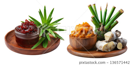 Pandanus fruit paste in wooden bowl with fresh pandanus leaves and fruit on wooden plate, isolated on white transparent background 136571442