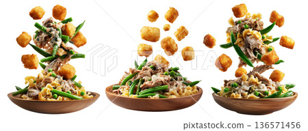 Bowls of green beans, crispy tater tots, and creamy tuna noodle casserole on wooden plate, isolated on white background 136571456