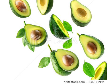 Whole and halved ripe avocados with green leaves, isolated on white background. Concept of fresh organic tropical fruit 136571994