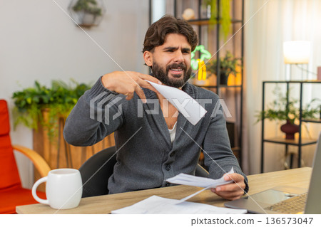 Indian man angry about extra receipt throws paper aside annoyed reaction rejects wrong bank charge Indian man angry about extra receipt throws paper aside annoyed reaction rejects wrong bank charge 136573047