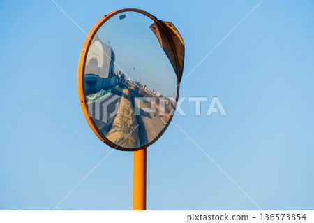 Convex mirror with blue sky Convex mirror with blue sky 136573854