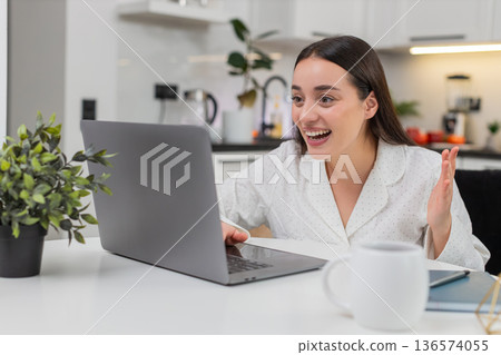 Young woman celebrates discount success promo code works smiles big happy reaction online shopping 136574055