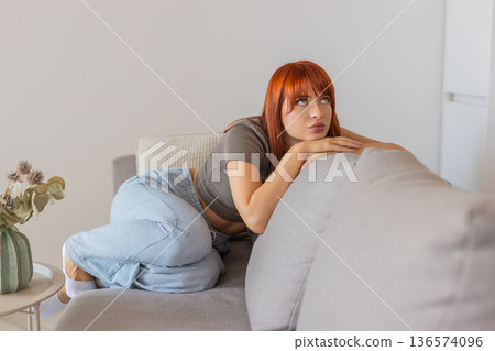 Young woman looks tired and in bad mood after hard news low energy sigh frustrated and drained mood Young woman looks tired and in bad mood after hard news low energy sigh frustrated and drained mood 136574096