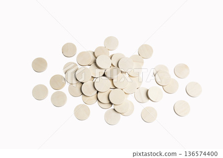 some rough wooden discs scattered 136574400