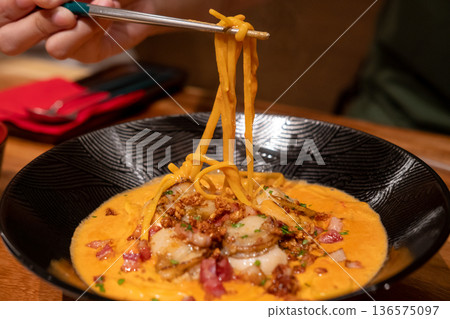 Spaghetti creamy tomato sauce with bacon scallop served on a plate. Soft Focus. Spaghetti creamy tomato sauce with bacon scallop served on a plate. Soft Focus. 136575097