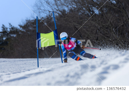Female skier practicing Female skier practicing 136576432