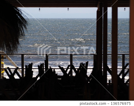 Beach house silhouette and sea Beach house silhouette and sea 136576975