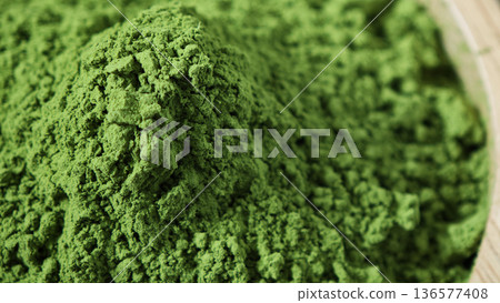 Matcha green tea powder in the wooden bowl Matcha green tea powder in the wooden bowl 136577408