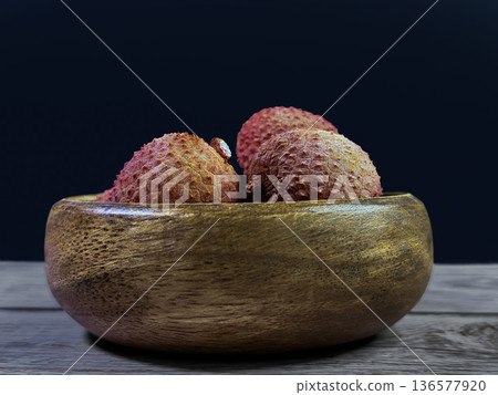 Lychee Fruit in Wooden Bowl Lychee Fruit in Wooden Bowl 136577920