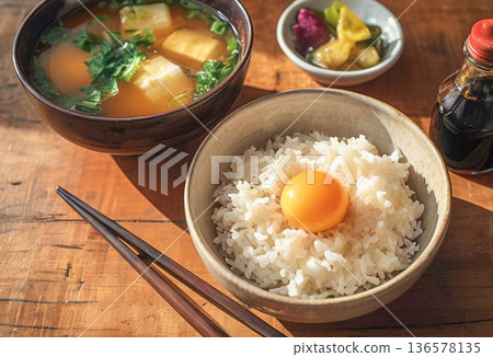 Breakfast plate of rice with raw egg and miso soup 136578135