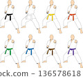 Karate athletes of various belt colors striking poses for kata 136578618