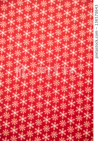 Red background with small snowflake pattern for christmas design Red background with small snowflake pattern for christmas design 136578643