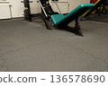 Empty gym interior with exercise equipment and puzzle mats 136578690