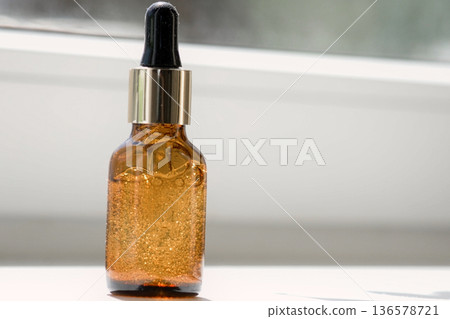 Natural oil cosmetics. Dropper glass amber Bottle Mock-Up. Oily cosmetic pipette. Face and body treatment. Spa concept. Mineral organic liquid. Front view. Beauty products. Blank packaging on white. Natural oil cosmetics. Dropper glass amber Bottle Mock-Up. Oily cosmetic pipette. Face and body treatment. Spa concept. Mineral organic liquid. Front view. Beauty products. Blank packaging on white. 136578721