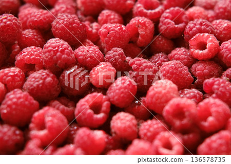 Sweet raspberry background. Full frame of fresh raspberries. Red ripe berry photo wallpaper closeup. Juicy berries. Vegetarian, vegan raw food. Organic bio product. From farm to table. Fruit pattern 136578735