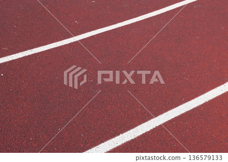 Sport floor. Interior of empty modern indoor sport court, coating Crumb rubber flooring, artificial. Sports surface with different marking lines. Recycled rubber Athletic field. Run track markup. 4K Sport floor. Interior of empty modern indoor sport court, coating Crumb rubber flooring, artificial. Sports surface with different marking lines. Recycled rubber Athletic field. Run track markup. 4K 136579133