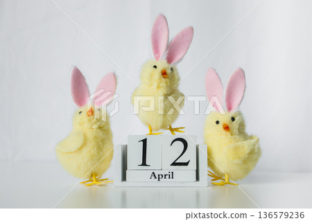 Christian Orthodox Easter 2026 date on a wooden calendar with three funny small Easter toy chicks on white background Christian Orthodox Easter 2026 date on a wooden calendar with three funny small Easter toy chicks on white background 136579236