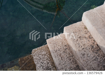 Stone Stairs Descending Into Clear Sea Water Stone Stairs Descending Into Clear Sea Water 136579426