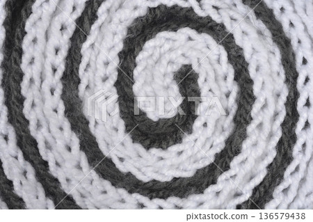 Spiral Pattern of White and Grey Knitted Wool Texture 136579438