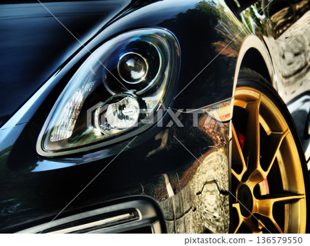 Black sports car headlights 136579550