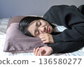Sleeping face of a Japanese woman sleeping in bed 136580277