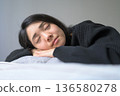 Sleeping face of a Japanese woman sleeping in bed 136580278