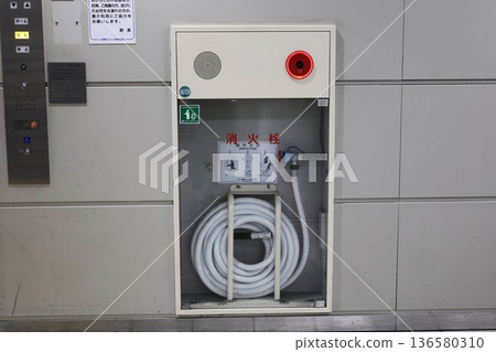 Emergency fire extinguishing equipment with visible hoses inside Emergency fire extinguishing equipment with visible hoses inside 136580310