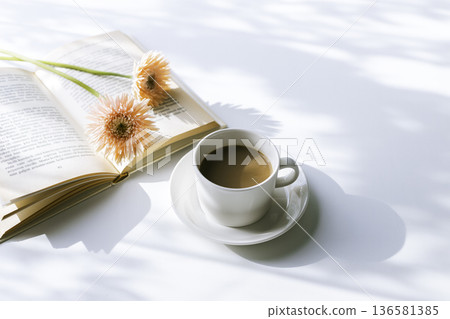 Gerberas, coffee, and reading - Morning sunshine filtering through the trees 136581385