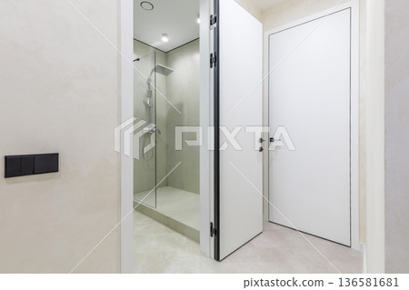 Modern Apartment Interior with Open Bathroom Door Modern Apartment Interior with Open Bathroom Door 136581681