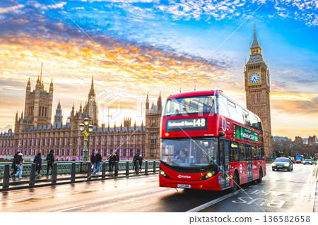 London: Palace of Westminster and double-decker bus at sunset 136582658