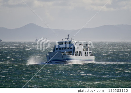 The Chita Peninsula sailing through rough seas and the car ferry "Shima Yuri" connecting the Chita Peninsula and remote islands. A scene of sailing on the sea in strong winds. 136583110