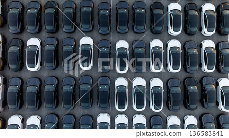 Aerial view car for sale stock lot row, Cars dealership inventory distribution automobile and automotive business, New cars parking for sale automobile automotive industry business. 136583841