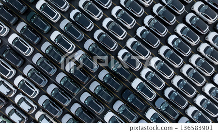 Aerial view car for sale stock lot row, Cars dealership inventory distribution automobile and automotive business, New cars parking for sale automobile automotive industry business. 136583901