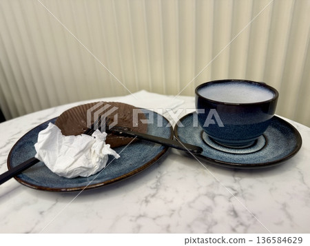 Coffee Cup Pastry On Marble Table, Freelancer Break In Cozy Modern Cafe With Blurred Background, Pastel Chairs, Circular Pendant Lights, Half Eaten Croissant On Wooden Board, Spoon 136584629