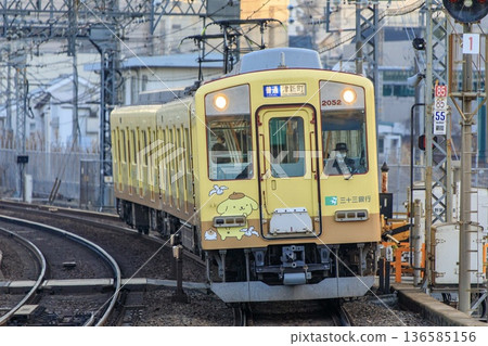 The 2050 series wrapped train running on the Kintetsu Nagoya Line The 2050 series wrapped train running on the Kintetsu Nagoya Line 136585156