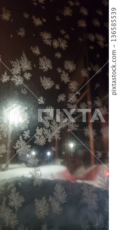 Frost on the glass of the entrance hood Frost on the glass of the entrance hood 136585539