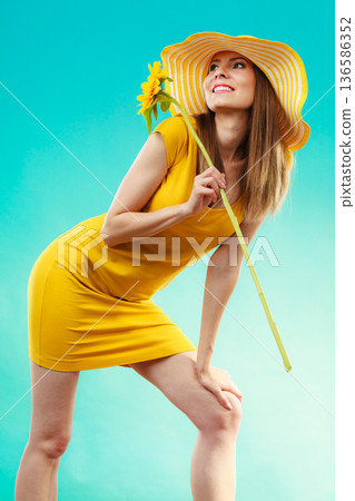 Summer woman in yellow dress with sunflower Summer woman in yellow dress with sunflower 136586352