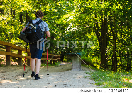 Young man alone in woodland. 136586525