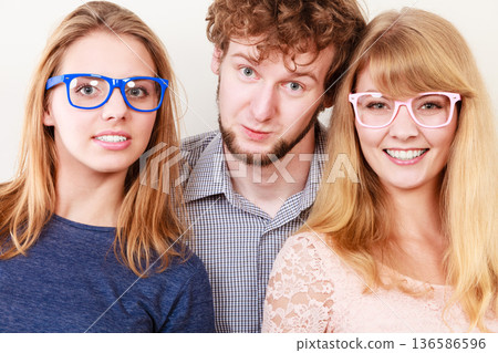 Happy friends man and women in glasses. 136586596
