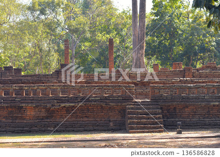Ruins of buildings, Buddhist architecture Old and decayed with brick walls and laterite 136586828