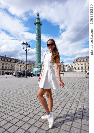Fashionable woman posing at Place Vendome Paris 136586839