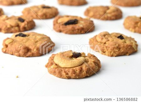Cashews and Raisins cookies on a white background Cashews and Raisins cookies on a white background 136586882