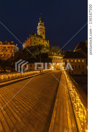 Cesky Krumlov Castle tower lighting historic town bridge at night 136587500