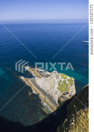 Rocky coastline and deep blue Cantabrian sea in Cudillero Rocky coastline and deep blue Cantabrian sea in Cudillero 136587575