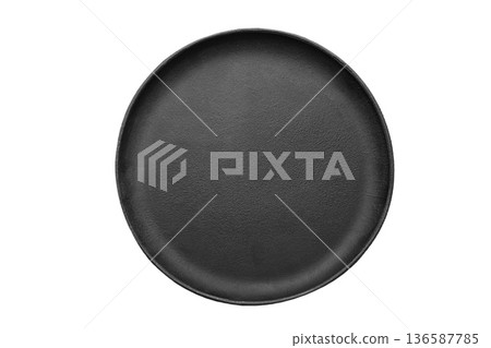 Top view of empty black cast iron round griddle pan isolated on white background. 136587785